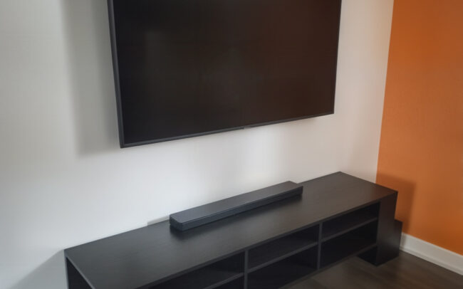 IQHome TV wall mount with in-wall cable management and floating TV stand in Toronto